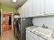 Bright laundry room with front-load washer and dryer at 585 Ambergate Nw Pl, Concord, NC 28027