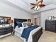 Spacious main bedroom with ceiling fan and ample closet space at 585 Ambergate Nw Pl, Concord, NC 28027