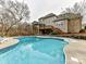 Large kidney-shaped pool and deck area at 585 Ambergate Nw Pl, Concord, NC 28027