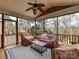 Relaxing screened porch with wooded views and ceiling fan at 585 Ambergate Nw Pl, Concord, NC 28027