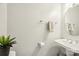 Small bathroom with pedestal sink, mirror and towel rack at 6033 Creft Cir, Indian Trail, NC 28079