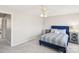 Guest bedroom with a blue velvet headboard and plenty of natural light at 6033 Creft Cir, Indian Trail, NC 28079