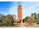 Brick clock tower in community with landscaping at 6033 Creft Cir, Indian Trail, NC 28079