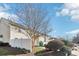 Townhouse exterior with white vinyl fence and landscaping at 6033 Creft Cir, Indian Trail, NC 28079