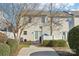 Back exterior of townhouse with private patio and landscaping at 6033 Creft Cir, Indian Trail, NC 28079