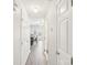 Hallway with light walls and doors leading to different rooms at 6033 Creft Cir, Indian Trail, NC 28079