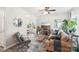 Living room with beige couch, coffee table, and a view into a home office area at 6033 Creft Cir, Indian Trail, NC 28079