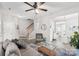 Spacious living room with a gray couch, coffee table, and view into the kitchen at 6033 Creft Cir, Indian Trail, NC 28079