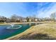 Community pond with fountain and homes nearby at 6033 Creft Cir, Indian Trail, NC 28079