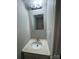 Small bathroom with a single sink and mirror at 6126 Bent Tree Ct, Charlotte, NC 28212