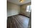 Bedroom with wood flooring and a window at 6126 Bent Tree Ct, Charlotte, NC 28212