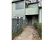 Two-story building with a gray door and walkway at 6126 Bent Tree Ct, Charlotte, NC 28212