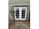 White French doors leading to a small patio area at 6126 Bent Tree Ct, Charlotte, NC 28212