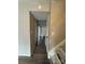 Hallway with laminate flooring and access to stairs at 6126 Bent Tree Ct, Charlotte, NC 28212