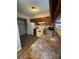 Kitchen with laminate floor, white appliances, and wood cabinets at 6126 Bent Tree Ct, Charlotte, NC 28212