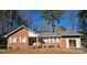 Brick ranch house with attached garage and landscaped yard at 625 Teddar Rd, Mount Gilead, NC 27306