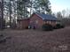 Brick house exterior with HVAC unit and yard at 625 Teddar Rd, Mount Gilead, NC 27306