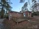 Brick house exterior with deck and mature trees at 625 Teddar Rd, Mount Gilead, NC 27306