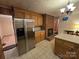 Kitchen features stainless steel appliances and brick fireplace at 625 Teddar Rd, Mount Gilead, NC 27306