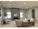 Light and airy living room with a modern fireplace and large windows at 722 Falling Oak Aly, Huntersville, NC 28078