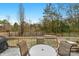 Deck with seating area and view of backyard with trampoline at 7845 Kuck Rd, Mint Hill, NC 28227