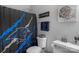 Bathroom with shower, toilet, and Carolina Panthers decor at 7845 Kuck Rd, Mint Hill, NC 28227