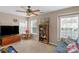 Large bedroom with TV, sofa, and built-in shelving at 7845 Kuck Rd, Mint Hill, NC 28227