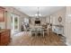 Bright dining room with access to the back deck and kitchen at 7845 Kuck Rd, Mint Hill, NC 28227