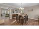 Bright dining room with hardwood floors and chandelier at 7845 Kuck Rd, Mint Hill, NC 28227