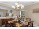 Bright dining room with hardwood floors and chandelier at 7845 Kuck Rd, Mint Hill, NC 28227