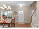 Bright dining room features a chandelier and table with seating for six at 7845 Kuck Rd, Mint Hill, NC 28227