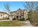 Two-story house with stone accents and a landscaped yard at 7845 Kuck Rd, Mint Hill, NC 28227