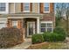 Inviting front entrance with stone accents and landscaping at 7845 Kuck Rd, Mint Hill, NC 28227