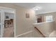 Upstairs hallway with access to bedrooms and additional space at 7845 Kuck Rd, Mint Hill, NC 28227