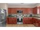 Well-equipped kitchen featuring stainless steel appliances and wood cabinets at 7845 Kuck Rd, Mint Hill, NC 28227