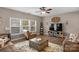 Relaxing living room with hardwood floors, two sofas, and a large TV at 7845 Kuck Rd, Mint Hill, NC 28227