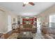 Open living room with a view of the kitchen and access to the back deck at 7845 Kuck Rd, Mint Hill, NC 28227