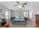 Spacious main bedroom with a king-size bed and ceiling fan at 7845 Kuck Rd, Mint Hill, NC 28227