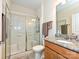 Bathroom with a glass door shower and granite countertop sink at 8024 Carolina Lakes Way, Fort Mill, SC 29707
