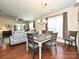 Inviting dining area with a table set for four, chandelier, and living room access at 8024 Carolina Lakes Way, Fort Mill, SC 29707
