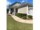 Charming home featuring a welcoming porch, manicured lawn, and tasteful landscaping with trimmed bushes along the walkway at 8024 Carolina Lakes Way, Fort Mill, SC 29707