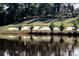 A water hazard and sand traps line the golf course at this luxury community at 8024 Carolina Lakes Way, Fort Mill, SC 29707