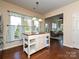 Bright breakfast nook featuring a center island, hardwood floors, pendant lighting, and natural light at 8024 Carolina Lakes Way, Fort Mill, SC 29707
