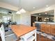 Kitchen with island seating and view into sunroom at 8024 Carolina Lakes Way, Fort Mill, SC 29707