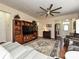 Living room with hardwood floors, comfortable seating, and a large TV at 8024 Carolina Lakes Way, Fort Mill, SC 29707