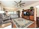 Spacious living room features a ceiling fan, beautiful rug, and comfortable seating at 8024 Carolina Lakes Way, Fort Mill, SC 29707