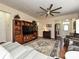 Open living room layout with entertainment center, ceiling fan, and comfortable seating at 8024 Carolina Lakes Way, Fort Mill, SC 29707