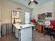 Bright and inviting office space features a large desk and ample storage for creative projects at 8024 Carolina Lakes Way, Fort Mill, SC 29707