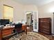 Comfortable office featuring hardwood floors, neutral walls, and natural light from large windows at 8024 Carolina Lakes Way, Fort Mill, SC 29707