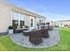 Relaxing patio area featuring wicker furniture and a built-in grill, perfect for outdoor entertaining at 8024 Carolina Lakes Way, Fort Mill, SC 29707